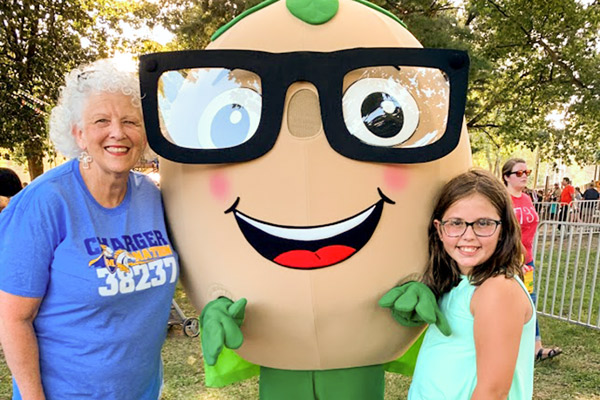 Super Soy Mascot With Lady And Child