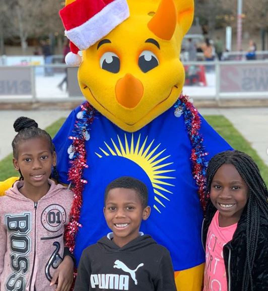 Truceratops Mascot with Kids For the Holidays