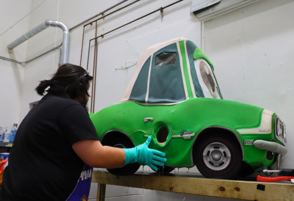 Professionally washing a custom foam mascot car