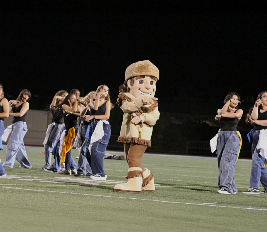 Mascot for Grossmont Foothiller High School dancing on the football field.