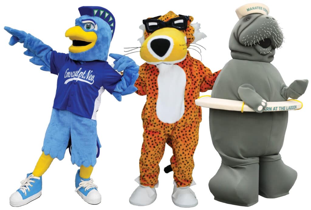 Three Olympus Mascots standing together. On the left is a bird mascot, in the middle is Chester Cheetah, and on the right is Moe the Manatee Mascot.