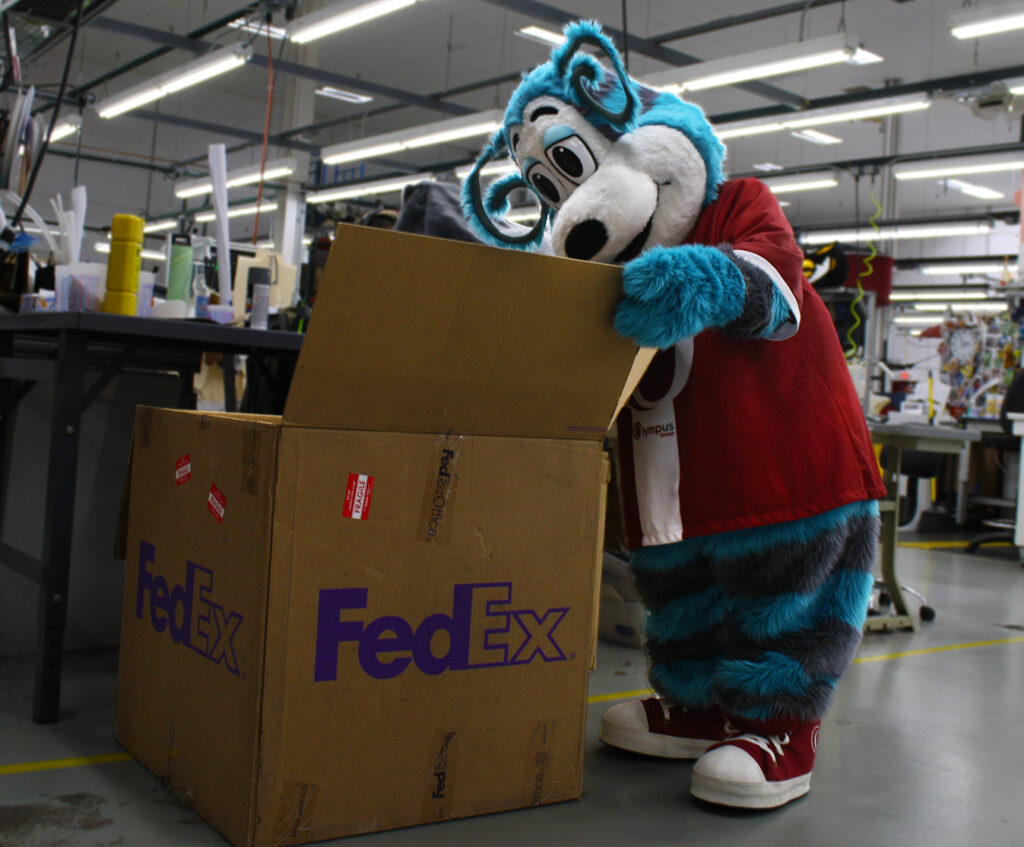 Ollie Olympus Mascot packing up a package.