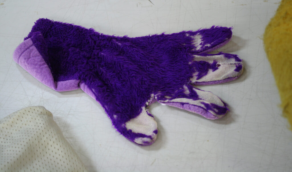An old and torn up mascot hand.