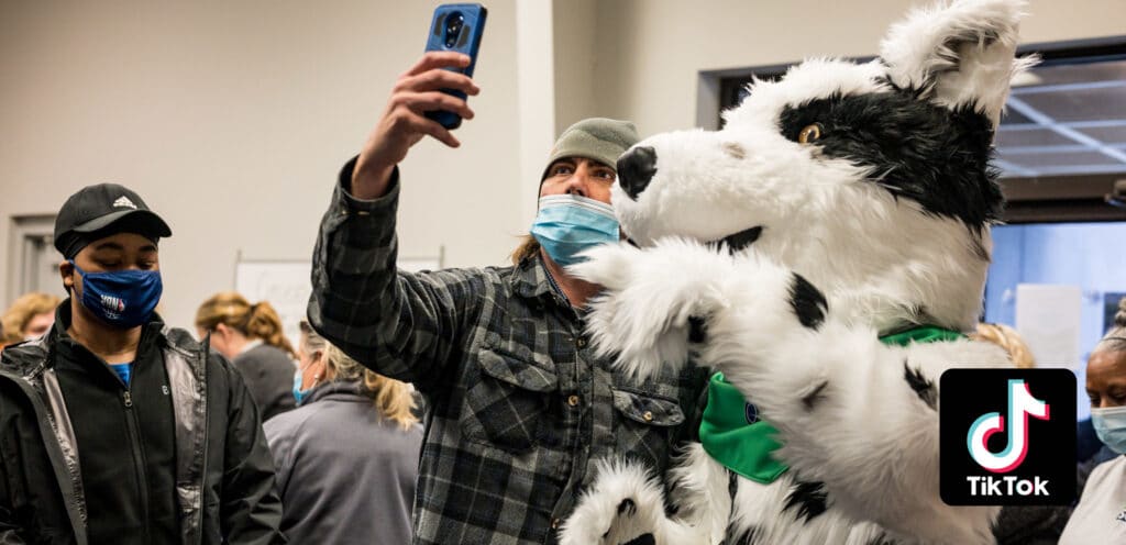 Chaser Mascot Costume With Student Taking a Selfie