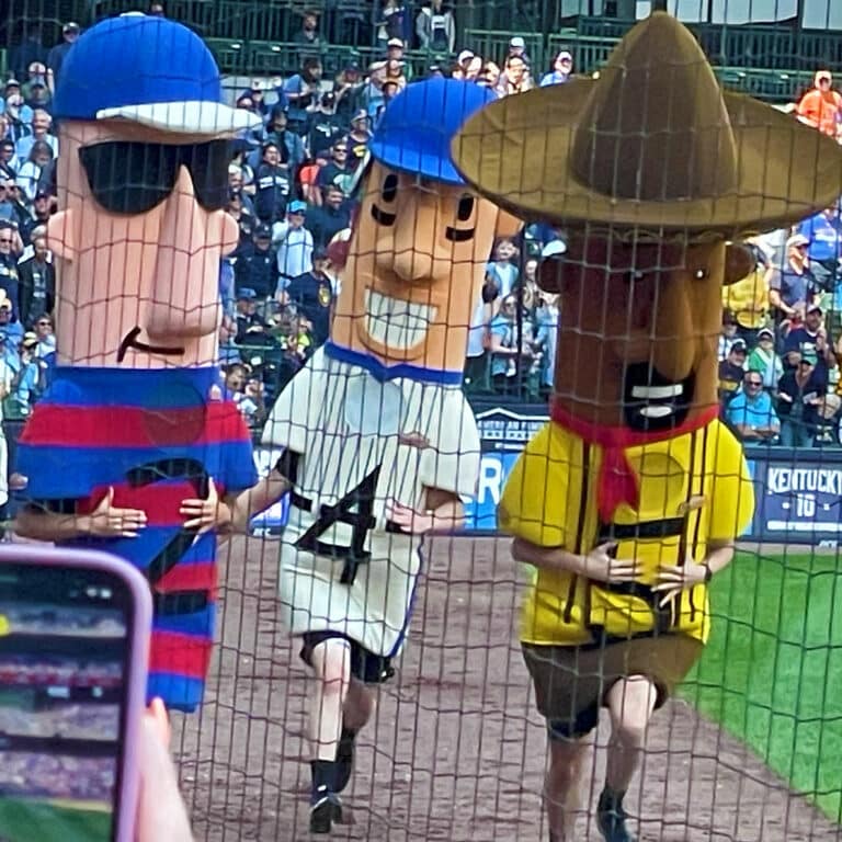 The Famous Racing Sausages running on the warning Track of Miller Park