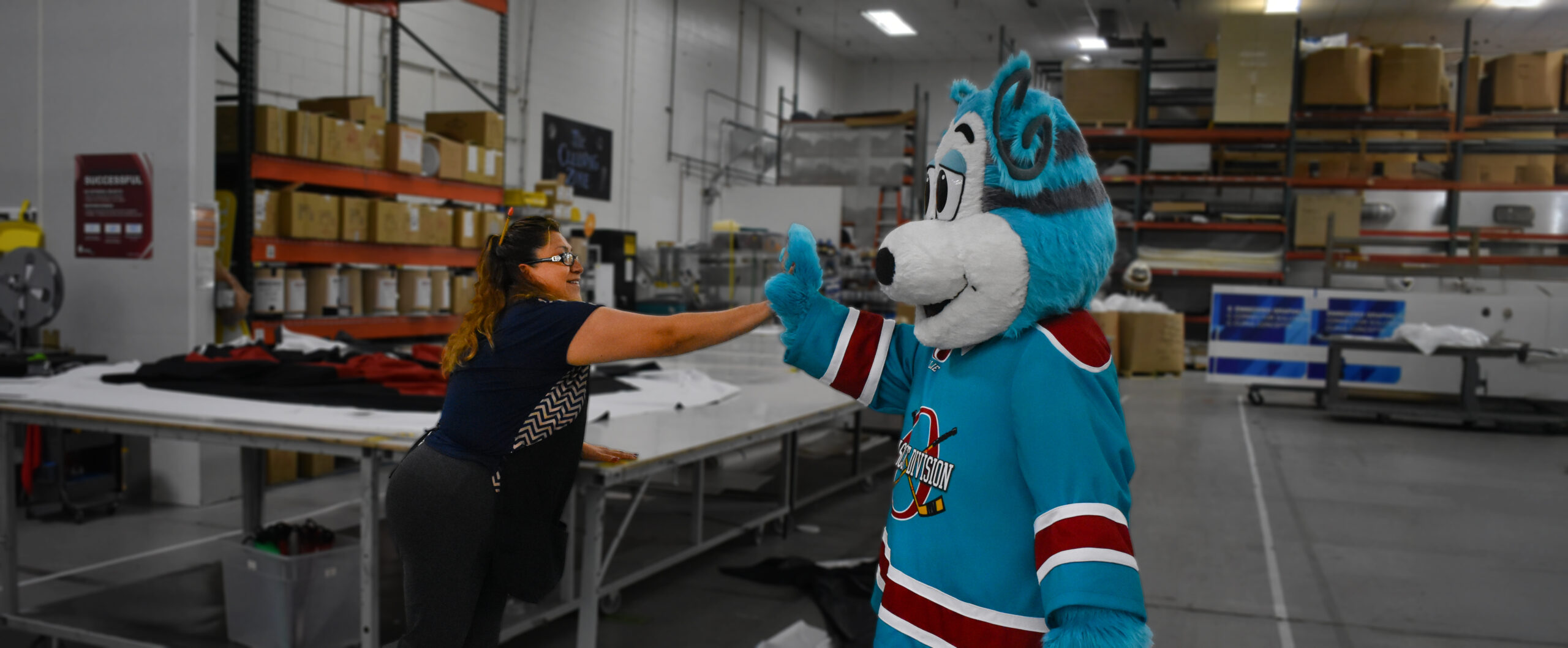 Oly Olympus giving an Olympus Employee a high five.