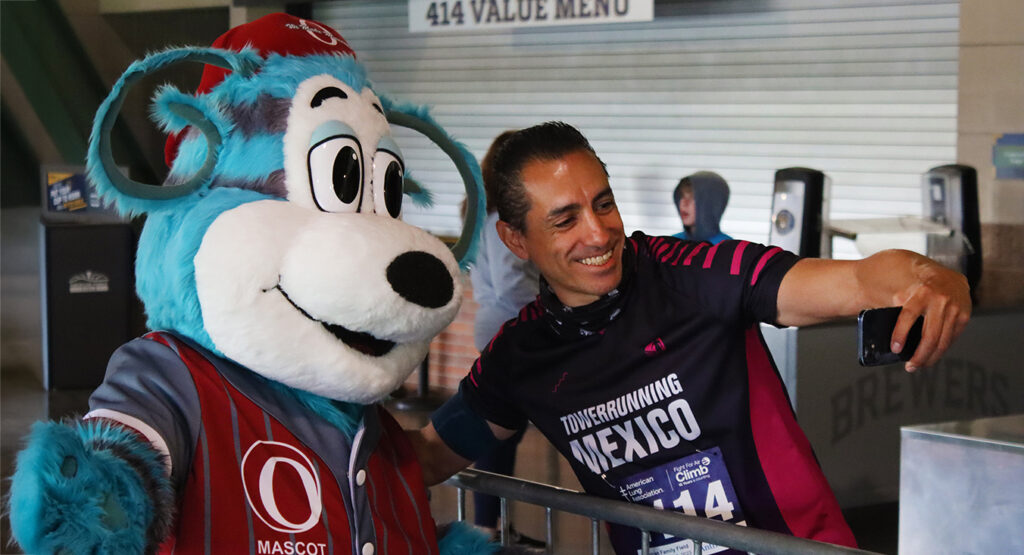 A person taking a selfie with Oly Olympus.