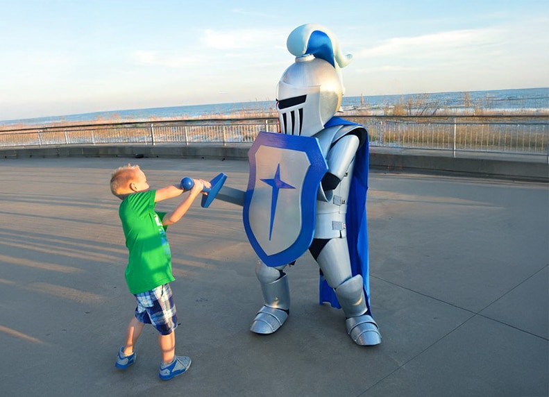Sir Maximus Mascot jousting with a kid.