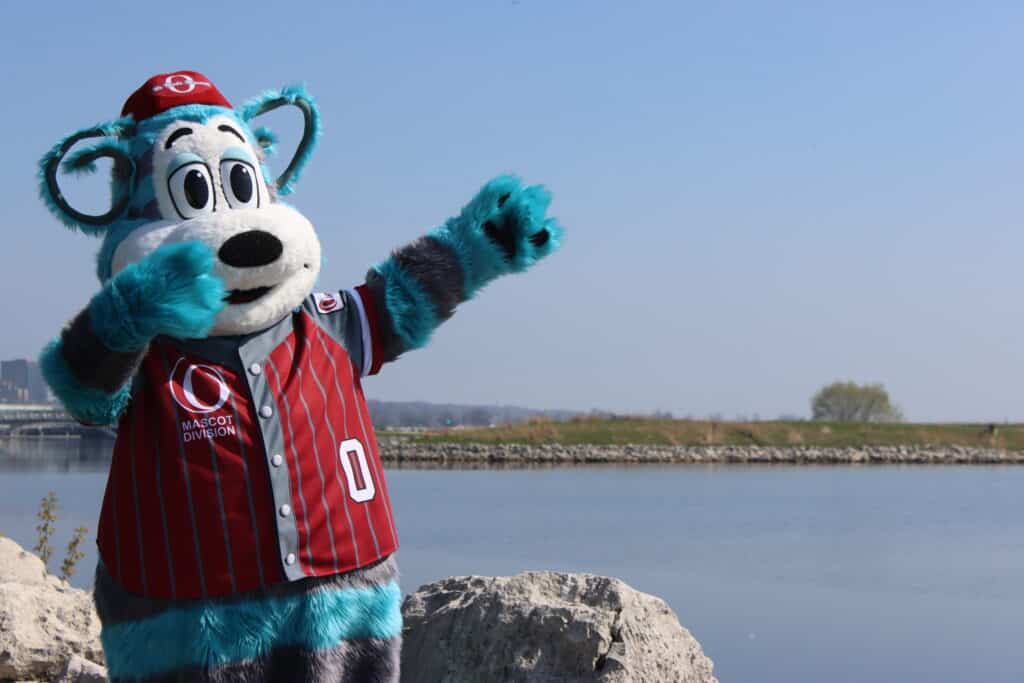 Oly Olympus enjoying some beautiful weather in front of a lake.